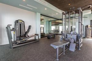 a gym with several treadmills and machines at MSW10 - 3 bedroom jacuzzi in Torrox Costa