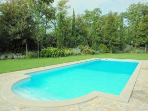 a large blue swimming pool in a yard at Apartment in Perugia with Pool & Terrace in Perugia