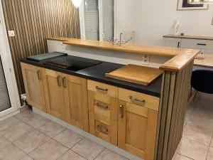 a kitchen with a sink and a counter top at La pétillante in Vertus +23 photos