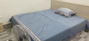 Ένα ή περισσότερα κρεβάτια σε δωμάτιο στο Rose Garden Homestay