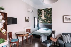 Et tv og/eller underholdning på Andrassy Garden Apartment in Center