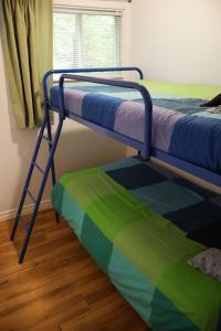 Ένα ή περισσότερα κρεβάτια σε δωμάτιο στο Chalet Vallée Bras-du-Nord I