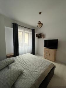 Ένα ή περισσότερα κρεβάτια σε δωμάτιο στο Apartament Cristi +6 φωτογραφίες
