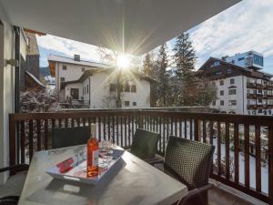 a table with a tray of food on a balcony at Apartment in Leogang near Ski Slopes in Leogang