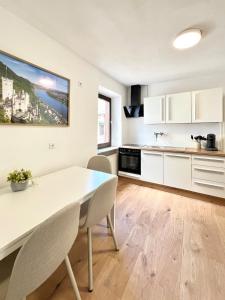 a kitchen with a dining room table and chairs at Apartment Brunnenstraße in Braubach in Braubach +15 photos