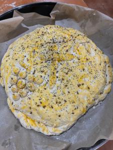 a pizza with cheese and spices on top at Спа Комплекс Ливадите in Deredzhik-Kʼoy