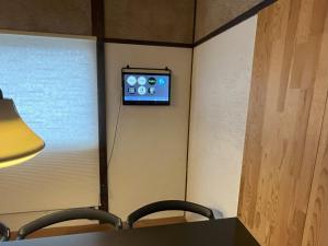 a room with an apple tv on the wall at AKUNOURA HUIS - Vacation STAY 10922 in Nagasaki