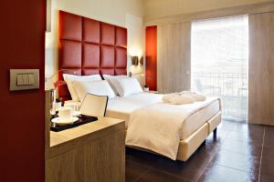Ένα ή περισσότερα κρεβάτια σε δωμάτιο στο Jazz Hotel