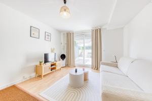 Ένα ή περισσότερα κρεβάτια σε δωμάτιο στο Urban cocon - 15 min de La Défense - 20min Paris