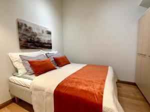 Ένα ή περισσότερα κρεβάτια σε δωμάτιο στο Levikaira Apartments - Log Cabins