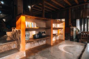 a book shelf with a camera on it in a room at Pousada Chápada dos Veadeiros in Alto Paraíso de Goiás +75 photos
