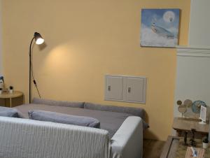 a living room with a bed and a couch at 芯禾慢旅-原禾恬cafe&bar in Puli