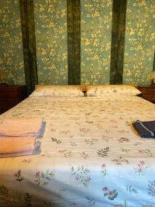 Ένα ή περισσότερα κρεβάτια σε δωμάτιο στο Rustichello G&P Tuscany