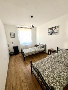 Giường trong phòng chung tại Le Loft du bonheur