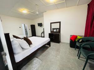 Ένα ή περισσότερα κρεβάτια σε δωμάτιο στο The Lavish Polonnaruwa