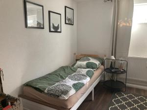 Postel nebo postele na pokoji v ubytování Ferienwohnung am Kinzigberg 5