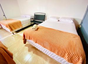 Ένα ή περισσότερα κρεβάτια σε δωμάτιο στο Nomads Family Rooms, Fortuna Town +38 φωτογραφίες