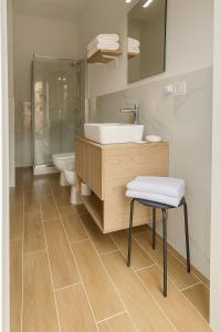 a bathroom with a sink and a shower and a toilet at Le Tortorelle in La Spezia +25 photos