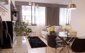 a living room with a table and a couch at Cozy, Elegant & Comfortable Apartment in Lima in Lima
