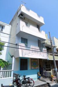 a building with bikes parked in front of it at Sai Rooms in Puducherry