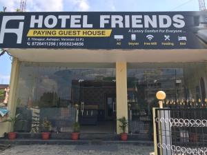 a hotel friends lodging guest house with a sign at HOTEL FRIENDs in Varanasi