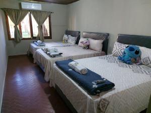 Postel nebo postele na pokoji v ubytování Encarnacion House + 67 fotografií