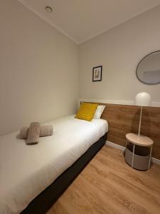 En eller flere senge i et værelse på Alfama Dream Apartments