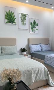 Giường trong phòng chung tại Homestay Hoàng Gia - Vinhomes Vũ Yên -Thuỷ Nguyên