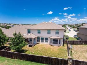 a house with a fence in a residential neighborhood at May 25' Reno ~Poker-Pool-Ping Pong-Shuffleboard in San Antonio