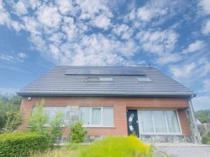 a house with solar panels on top of it at Villa-gey Escape in Bekkevoort