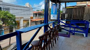 a blue table and chairs on a balcony at Pousada Maresia Centro - Piscinas Naturais in Porto De Galinhas +31 photos