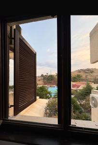 an open window with a view of a patio at Sea&Sun in Sutomore