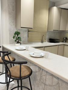 Η κουζίνα ή μικρή κουζίνα στο شقق واستديوهات SiS +10 φωτογραφίες