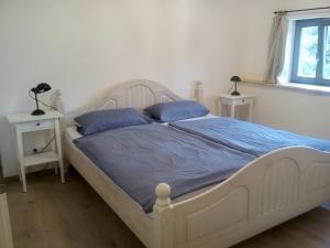 Postel nebo postele na pokoji v ubytování Elmenhof + 2 fotografie