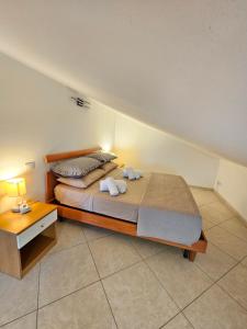 a bedroom with a bed with two towels on it at Attico Bellavista in Termoli