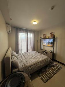 Ένα ή περισσότερα κρεβάτια σε δωμάτιο στο Cozy Studio with Pool & Balcony near Mactan Airport +31 φωτογραφίες