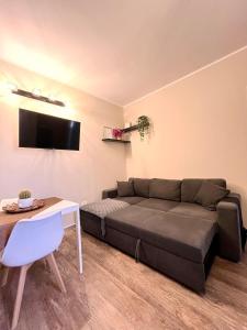 a living room with a couch and a table at La Casetta in Ladispoli