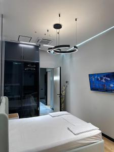 Ένα ή περισσότερα κρεβάτια σε δωμάτιο στο NestOne - Apartment hotels