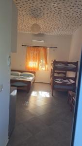 a room with two bunk beds and a window at Toska homes in Mullini i Danit +6 photos