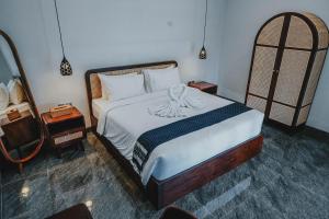 En eller flere senge i et værelse på Villa Dayana Canggu + 23 billeder