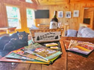 a bottle of wine sitting on top of a table at New Mtn Views Hot Tub Arcade Chess in Sautee Nacoochee