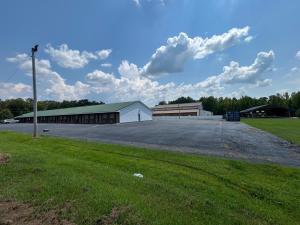 an empty parking lot in front of a building at Deerfield Inn in Parsons