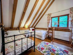 a bedroom with two bunk beds and a window at Nightingale Barn - Stunning & Huge in Etchingham