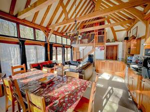 a kitchen and dining room with a table and chairs at Nightingale Barn - Stunning & Huge in Etchingham