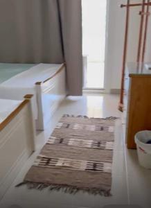 a room with a rug on the floor in a room at Ground peaceful chalet 3 bedroom with 6 king bed & 2 bathrooms &private garden marvelous land escape Murano resort Ain sokhna in Ain Sokhna +29 photos