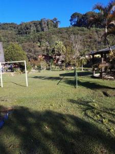 a field with a soccer ball and a goal at Sítio Isolina Piscina, Campo e Lago in Juquitiba