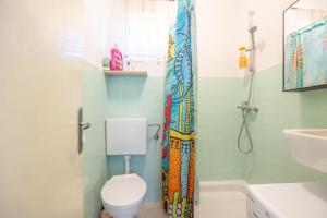 a bathroom with a toilet and a sink and a shower at House Bojan in Supetar +44 photos