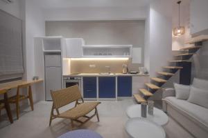 a kitchen and a living room with a couch and a table at Antara in Stení