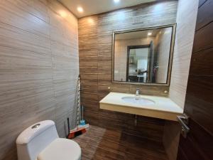 a bathroom with a sink and a mirror at Private 1 BHK Suite - Islamabad, Bahria Town in Rawalpindi +4 photos