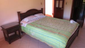 Postel nebo postele na pokoji v ubytování Posada De Los Santos Hotel Rural, La Candelaria